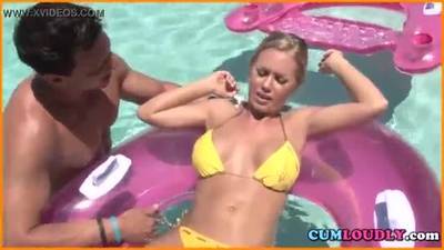 Blonde gets naughty in a pool