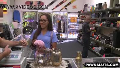 Brunette babe plays with her pussy at the pawn shop
