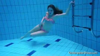 Sexy girl shows magnificent young body underwater